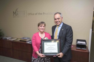 President Ángel Cabrera presents the Employee of the Month award to Deborah Hutton at a ceremony at the Fairfax Campus. Photo by Alexis Glenn/Creative Services/George Mason University