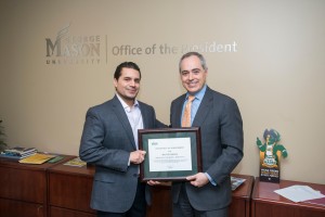 President Ángel Cabrera presents the Employee of the Month award to Melvin Parada at a ceremony at the Fairfax Campus. Photo by Alexis Glenn/Creative Services/George Mason University