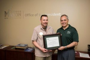 President Ángel Cabrera presents the Employee of the Month award to Robert Sparkman at a ceremony at the Fairfax Campus. Photo by Alexis Glenn/Creative Services/George Mason University